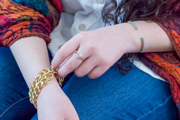 Demonstration of securing a safety chain on a Pandora bracelet